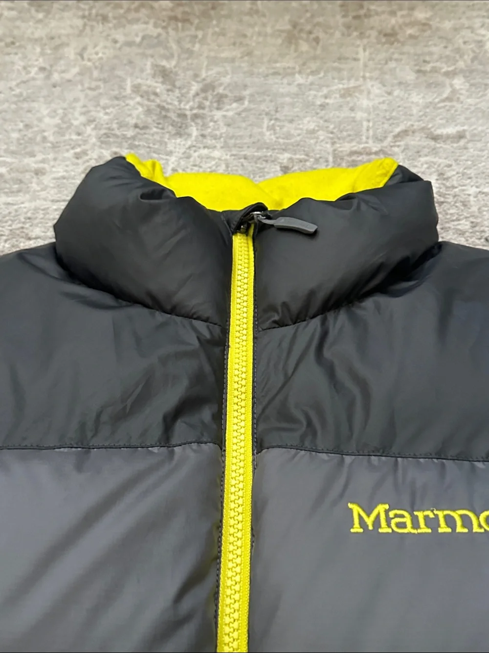 Marmot Men’s Large Gray and Yellow Puffy Down Vest. 700-fill.